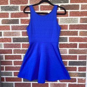 Royal blue sleeveless dress with a V in the back. Size is a small.